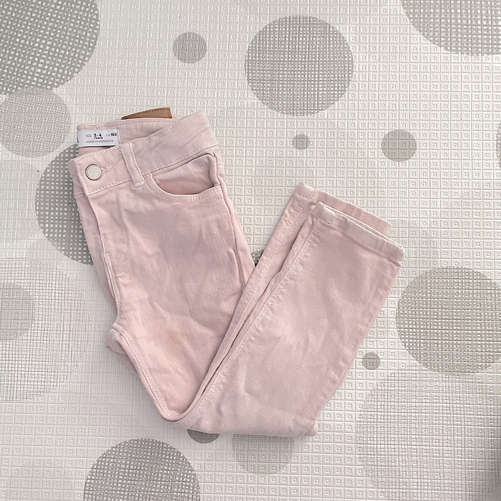Pale pink skinny jeans